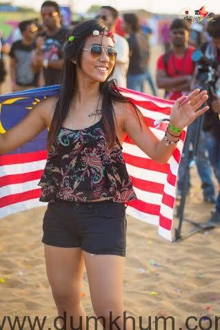 A festival visitor basking under the sun ... ing the music at Vh1 Supersonic 2015