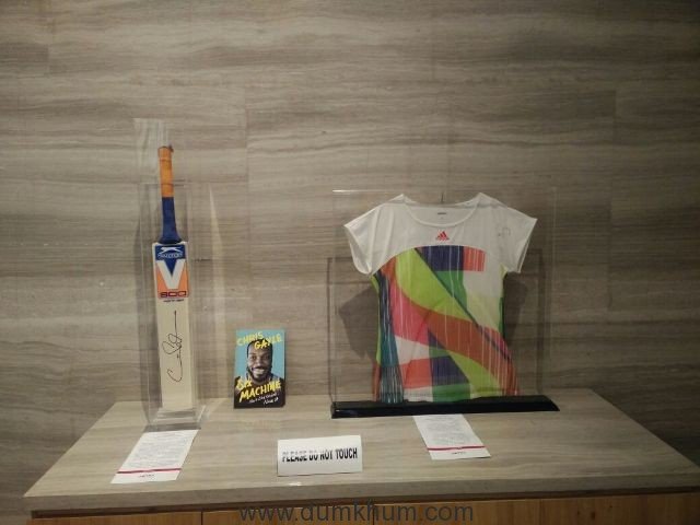 Sania Mirza's jersey and Chris Gayle's signed bat & book