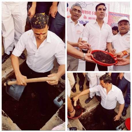 Akshay Kumar digging his first two pit toilet in khargibe district of MP, with minister Narendra Singh Tomar